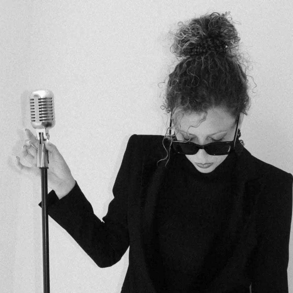 Laiana performing with vintage microphone