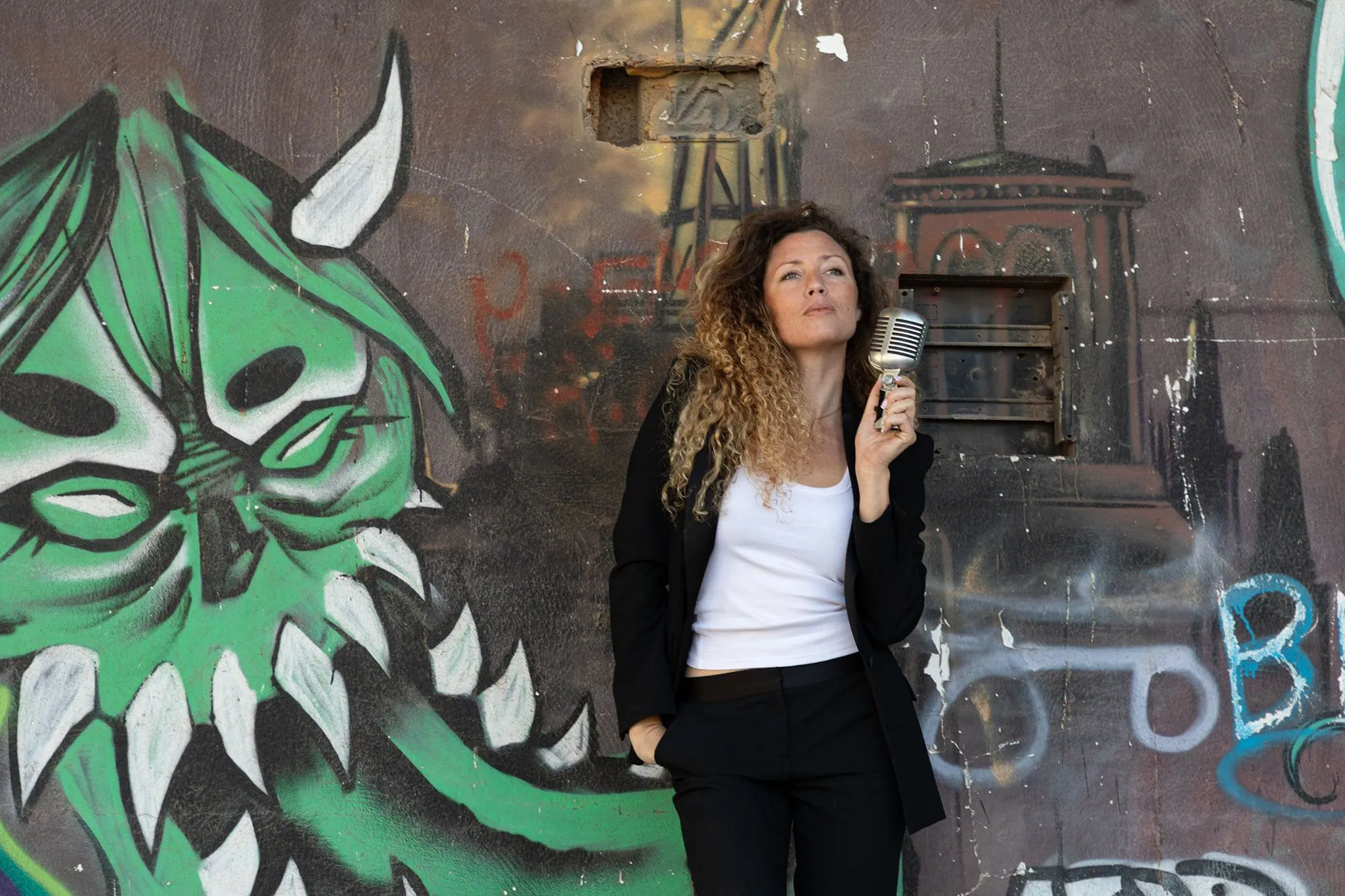 Laiana performing against colorful backdrop